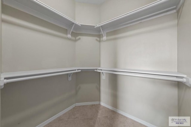 7136 Arroyo Blvd, Brownsville, TX 78526 - walk in closet featuring tile patterned floors