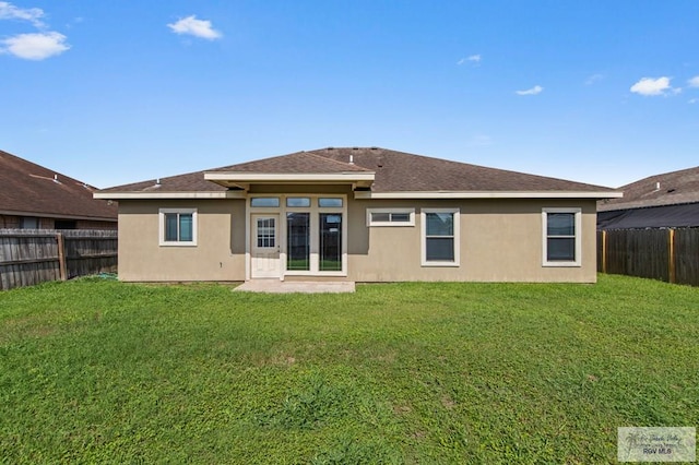 7136 Arroyo Blvd, Brownsville, TX 78526 - rear view of house with stucco siding and roof with shingles