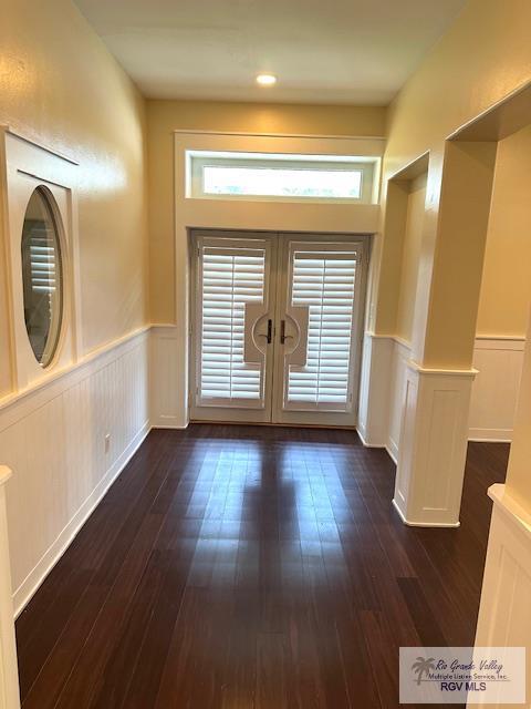 entrance foyer with dark hardwood / wood-style flooring