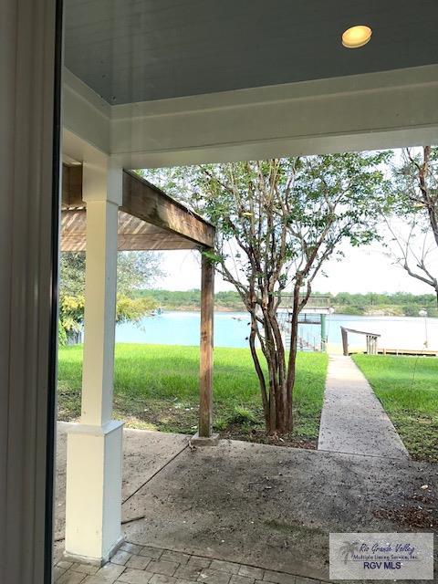 view of patio featuring a water view