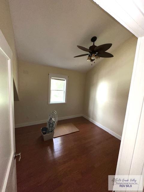 unfurnished room with dark hardwood / wood-style floors and ceiling fan