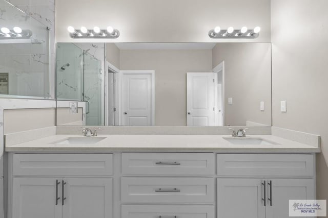 9372 Fan Palm Dr, Los Fresnos, TX 78521 - full bath featuring a marble finish shower and double vanity