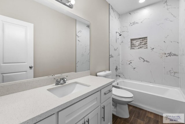9372 Fan Palm Dr, Los Fresnos, TX 78521 - bathroom with wood finished floors, vanity, toilet, shower / bathtub combination, and recessed lighting