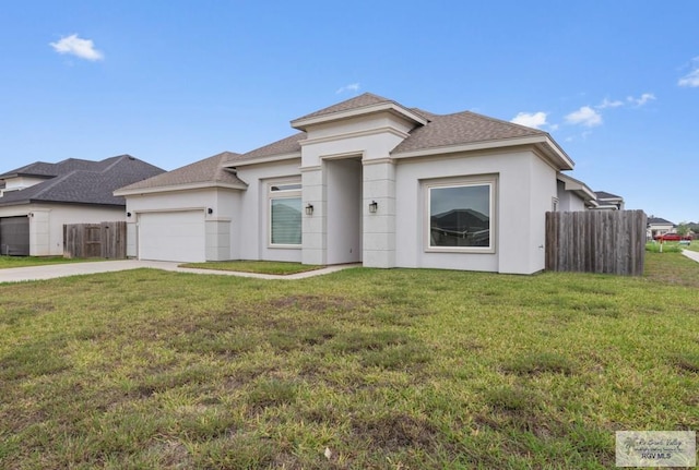 9372 Fan Palm Dr, Los Fresnos, TX 78521 - prairie-style house featuring a garage, roof with shingles, concrete driveway, and stucco siding