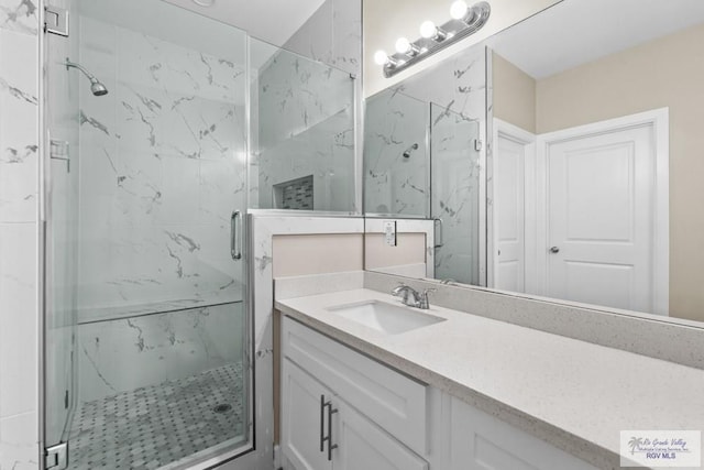 9372 Fan Palm Dr, Los Fresnos, TX 78521 - full bathroom featuring a marble finish shower and vanity