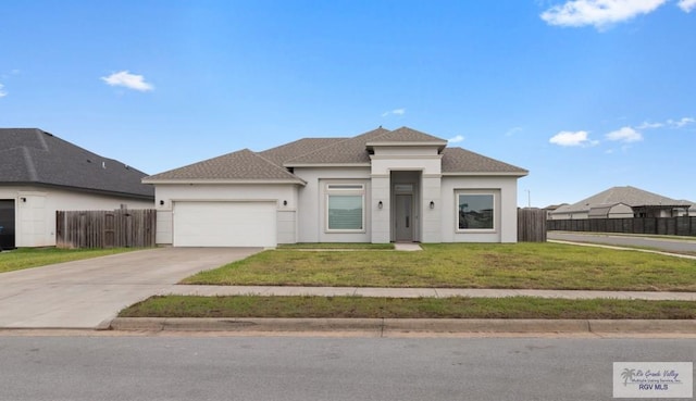 9372 Fan Palm Dr, Los Fresnos, TX 78521 - prairie-style home featuring concrete driveway, a garage, and stucco siding