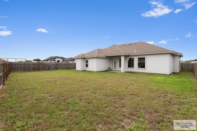 9372 Fan Palm Dr, Los Fresnos, TX 78521 - rear view of house with stucco siding
