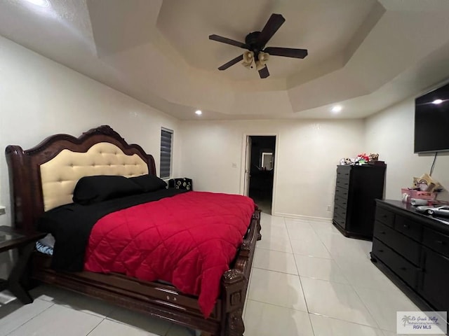 4870 Mckenzie Rd, Brownsville, TX 78521 - bedroom featuring a raised ceiling, light tile patterned floors, ceiling fan, recessed lighting, and baseboards