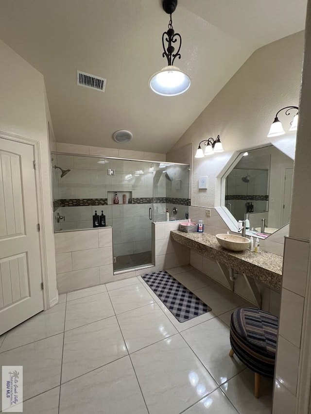 4870 Mckenzie Rd, Brownsville, TX 78521 - full bath featuring lofted ceiling, a sink, a stall shower, and tile patterned flooring
