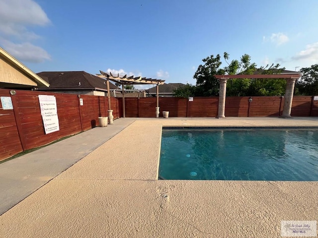 4870 Mckenzie Rd, Brownsville, TX 78521 - view of swimming pool with a pergola