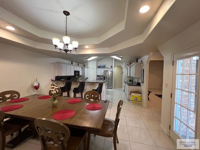 4870 Mckenzie Rd, Brownsville, TX 78521 - dining room featuring a chandelier, a raised ceiling, light tile patterned floors, and recessed lighting