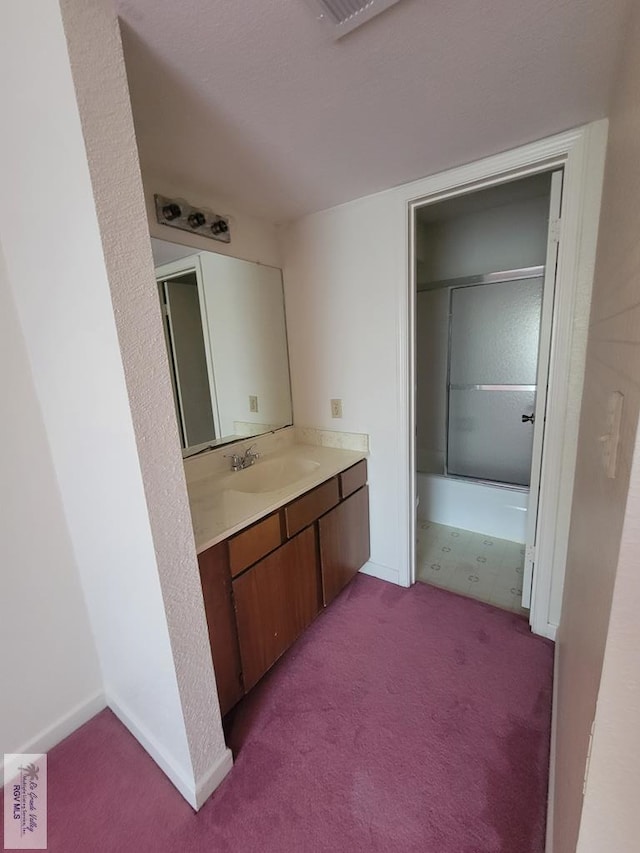 bathroom featuring vanity and shower / bathtub combination