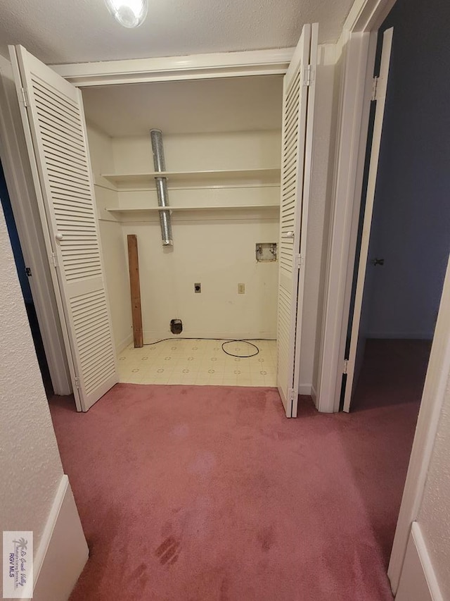 clothes washing area featuring carpet flooring, hookup for a washing machine, and electric dryer hookup