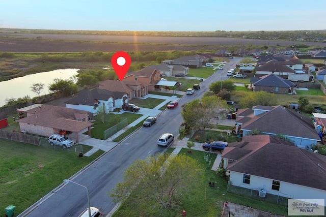 birds eye view of property with a residential view