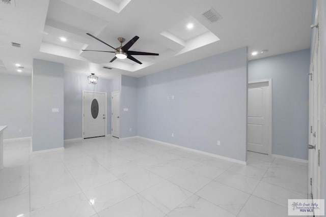 unfurnished room featuring visible vents, baseboards, a tray ceiling, recessed lighting, and a ceiling fan