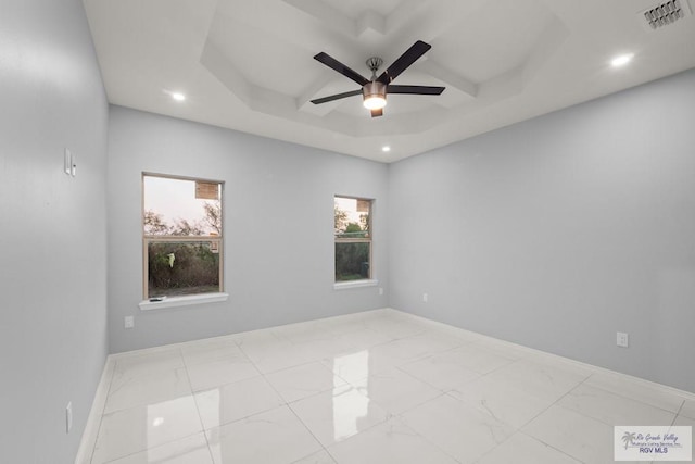 empty room with visible vents, baseboards, and marble finish floor