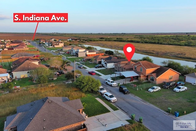 bird's eye view featuring a residential view and a water view