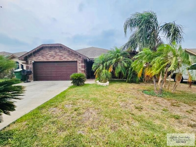 view of front of property with a front lawn and a garage