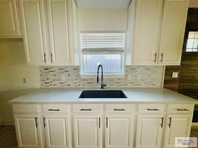 kitchen featuring decorative backsplash and sink