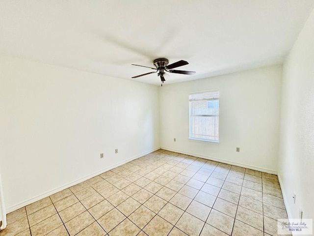 unfurnished room featuring ceiling fan and light tile patterned flooring