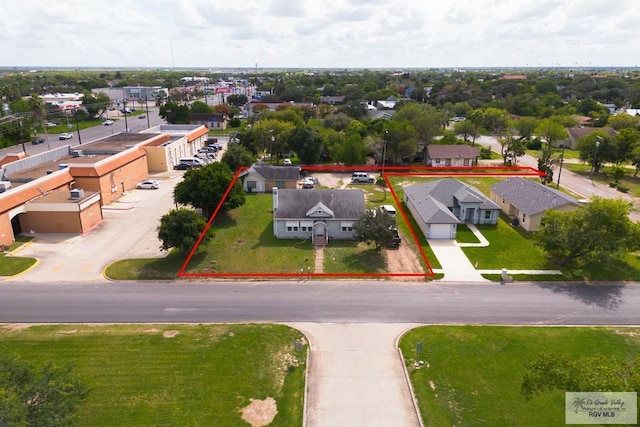 birds eye view of property with a residential view