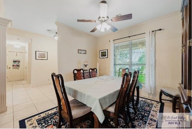 tiled dining room featuring ceiling fan and ornamental molding