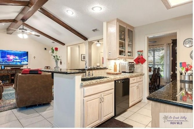 kitchen with kitchen peninsula, black dishwasher, lofted ceiling with beams, light tile patterned flooring, and sink