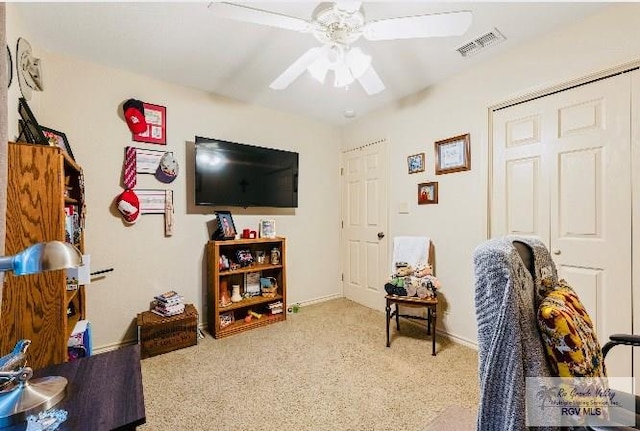 interior space featuring ceiling fan and carpet flooring