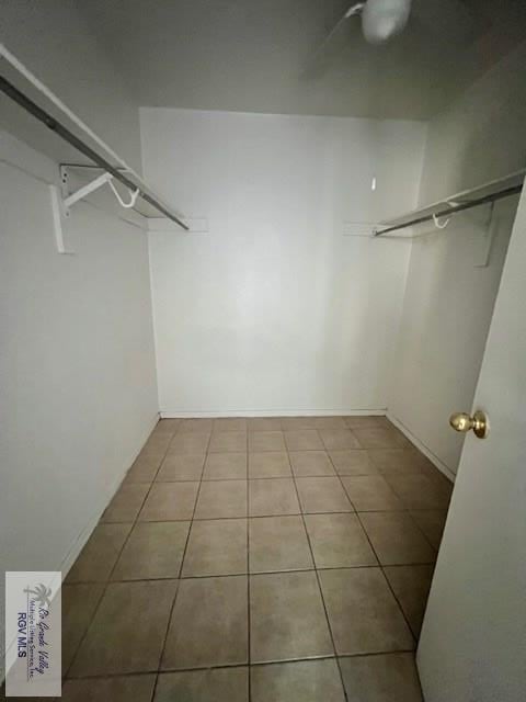 spacious closet featuring tile patterned floors