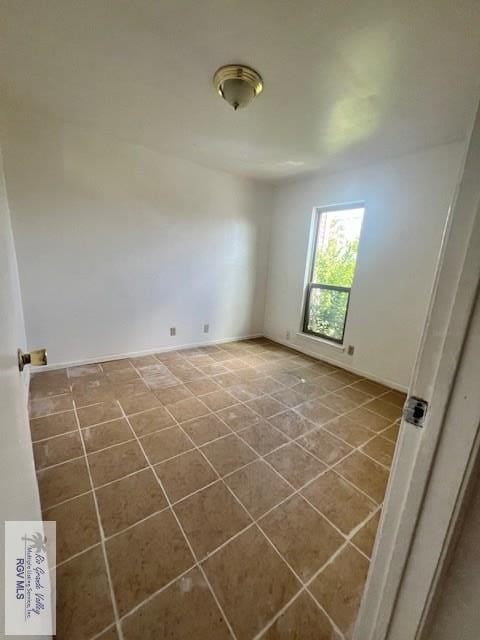 view of tiled spare room