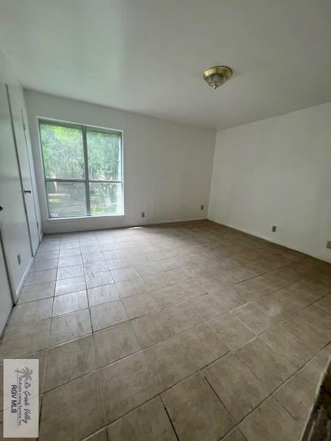 view of tiled spare room