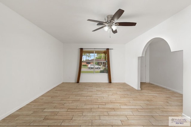 unfurnished room with light hardwood / wood-style flooring and ceiling fan