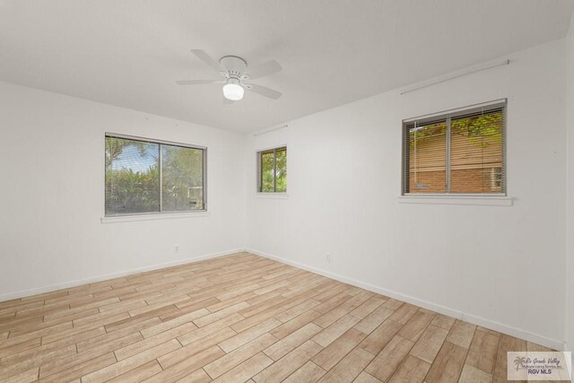 unfurnished room featuring light hardwood / wood-style floors and ceiling fan