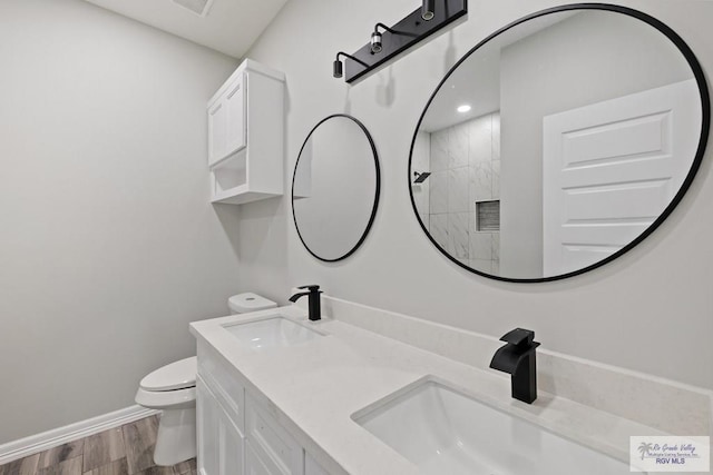 2832 Eliseo Villarreal Ave, Port Isabel, TX 78578 - full bath featuring wood finished floors, double vanity, and tiled shower
