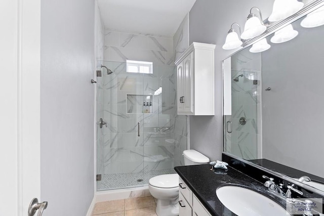 131 E Saturn Ln, South Padre Island, TX 78597 - bathroom featuring a marble finish shower, vanity, and tile patterned floors