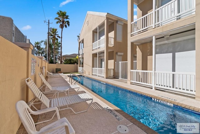 131 E Saturn Ln, South Padre Island, TX 78597 - community pool with a patio