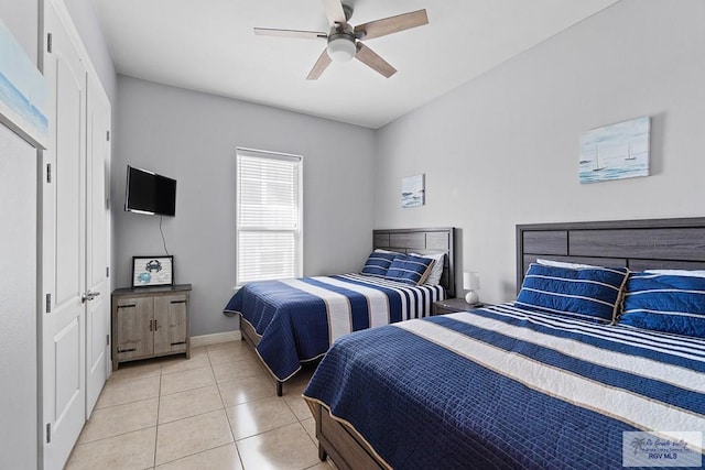 131 E Saturn Ln, South Padre Island, TX 78597 - bedroom featuring light tile patterned floors and a ceiling fan