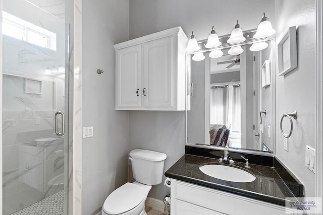 131 E Saturn Ln, South Padre Island, TX 78597 - bathroom with a stall shower, vanity, and ceiling fan
