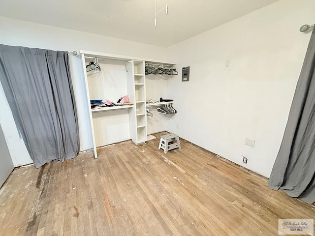 washroom with wood-type flooring