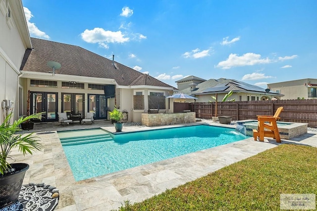 view of swimming pool featuring an in ground hot tub and a patio