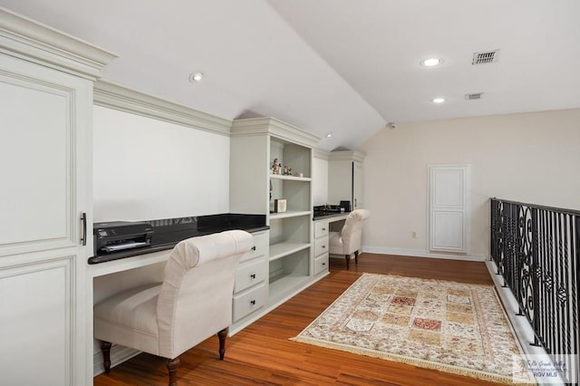 office area with wood-type flooring and vaulted ceiling