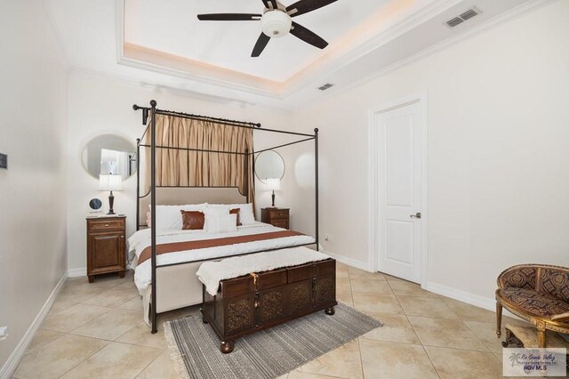 bedroom featuring a raised ceiling, ceiling fan, crown molding, and light tile patterned flooring