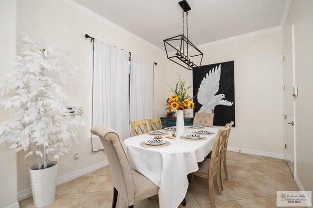 tiled dining room featuring crown molding