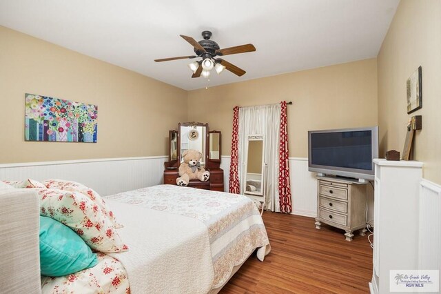 bedroom featuring hardwood / wood-style flooring and ceiling fan