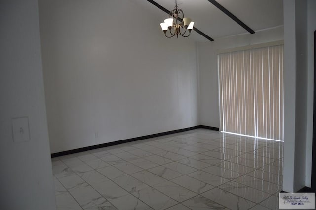 empty room featuring an inviting chandelier, marble finish floor, and baseboards