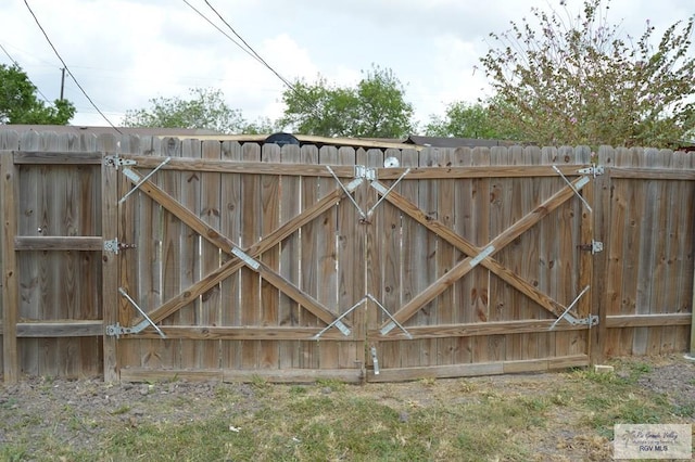 view of gate featuring fence