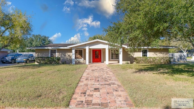 ranch-style house with a front lawn