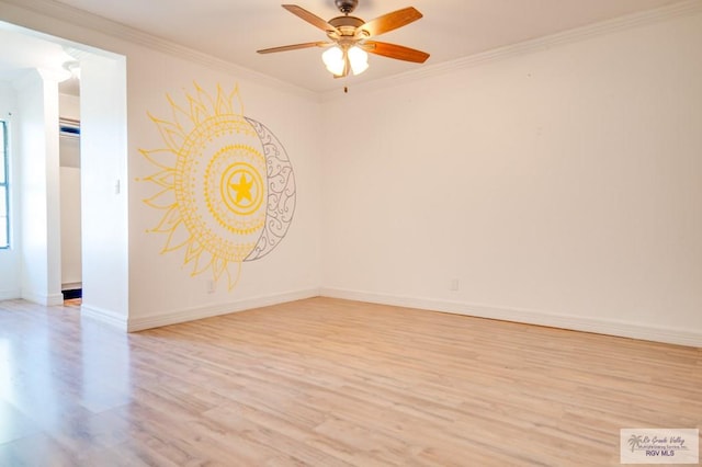 spare room featuring light hardwood / wood-style floors, ceiling fan, and crown molding