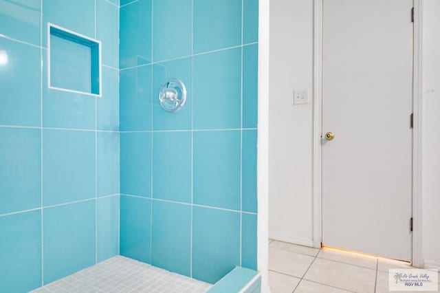 bathroom featuring tile patterned floors and a shower