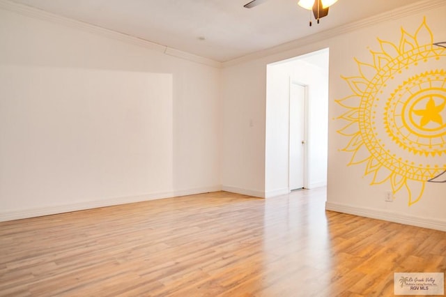 spare room featuring ceiling fan, light wood-type flooring, and ornamental molding